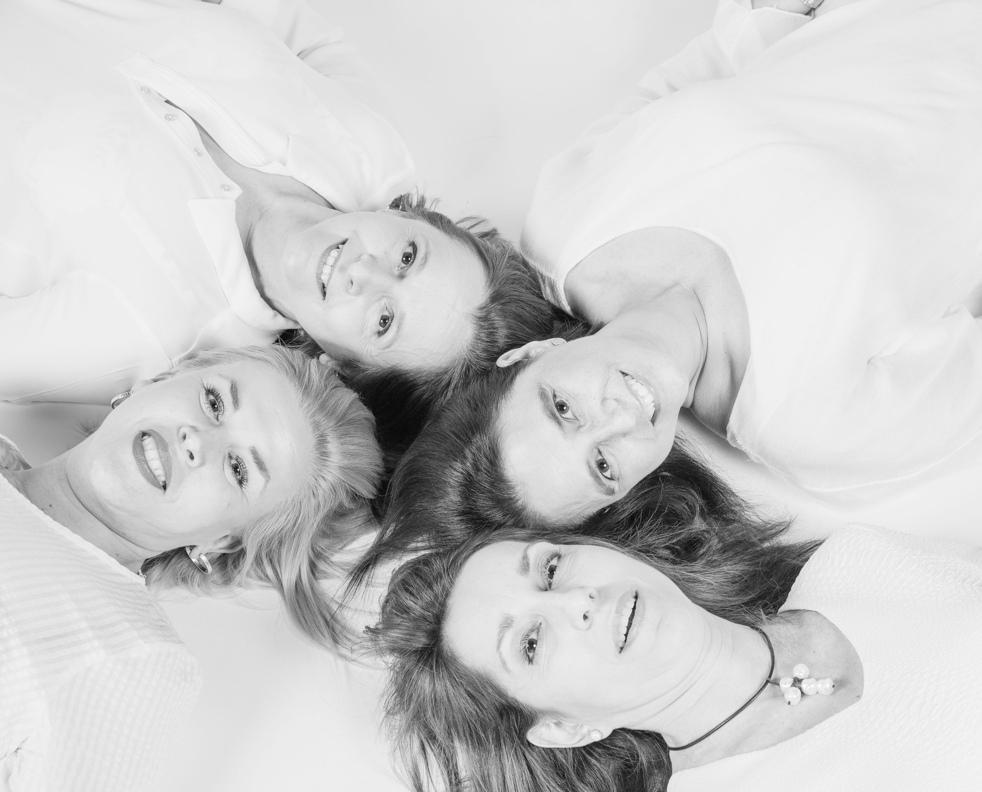 Photographs of a group of friends lying on the floor